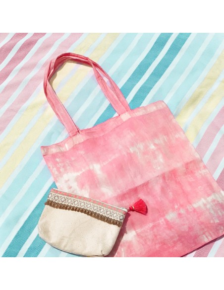 Bolso de tela shopping de tela con efecto desteñido rosa.