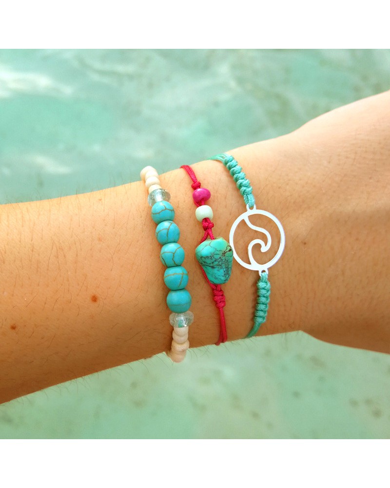 Pulseras turquesa y fucsia